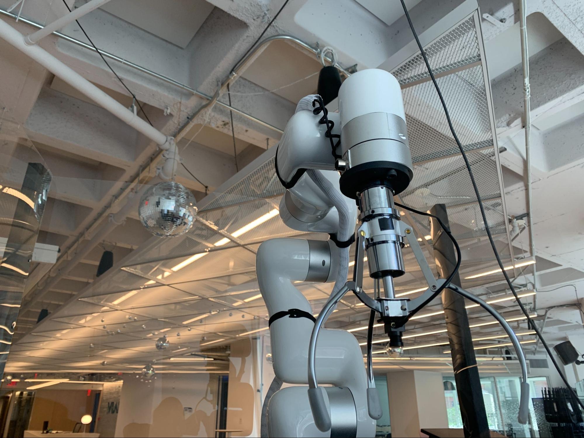 Gripper attached to the arm and cord wired around the arm